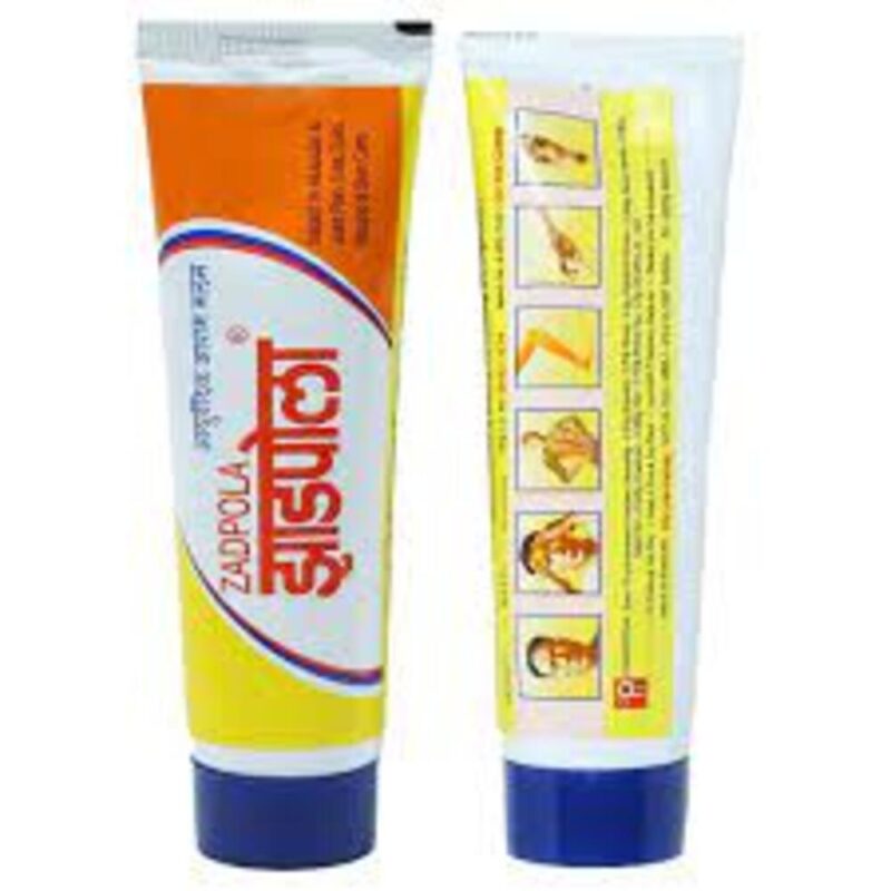 Front and back view of Zadpola Ayurvedic cream tube, used for headache, joint pain, cold, and muscular relief with illustrated application instructions